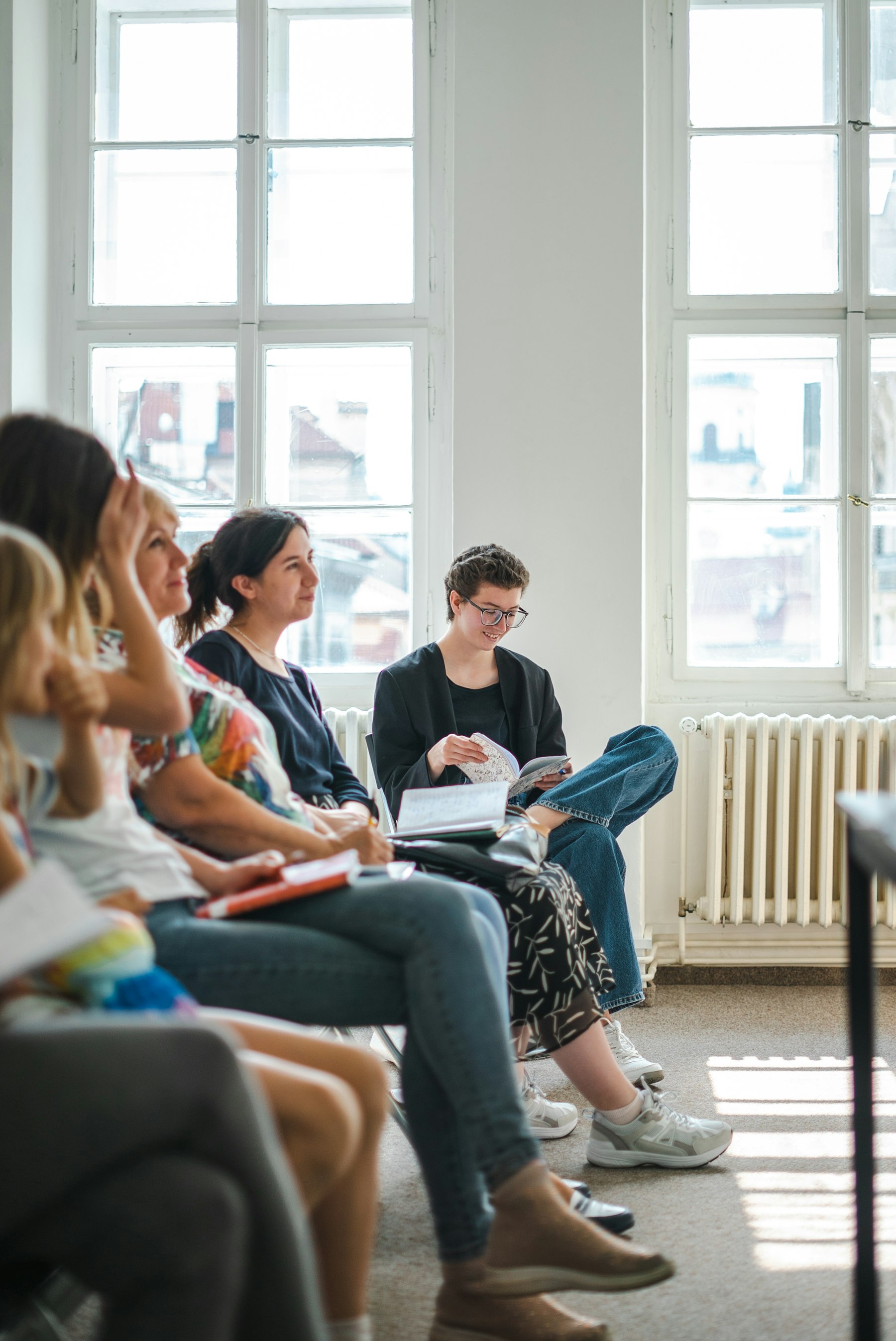People gathered together in a bright room
