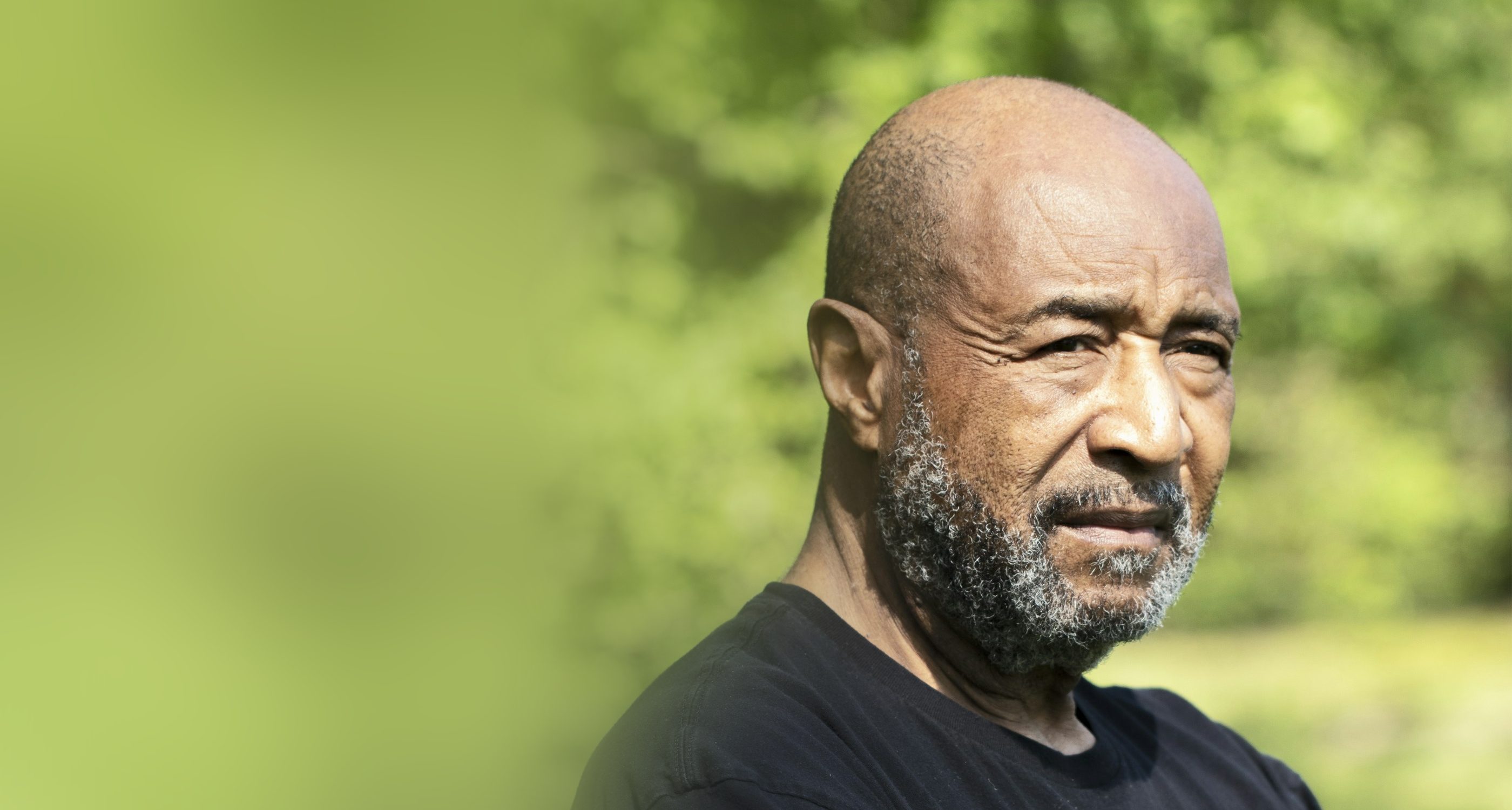 An older man outdoors in warm light